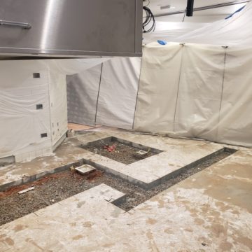 Prepared concrete work area in a commercial interior